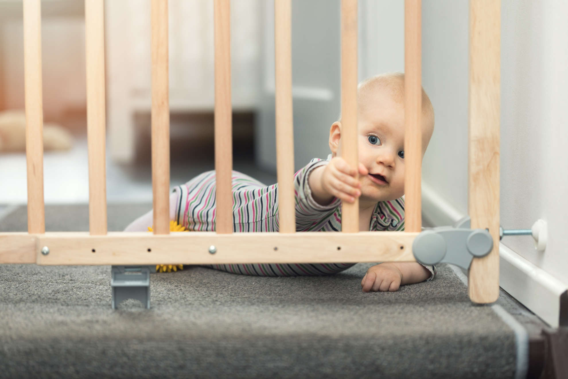 Photo of baby at a stair gate 