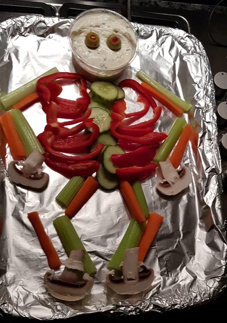 Skeleton  made from red peppe, celery, carrots and mushrooms