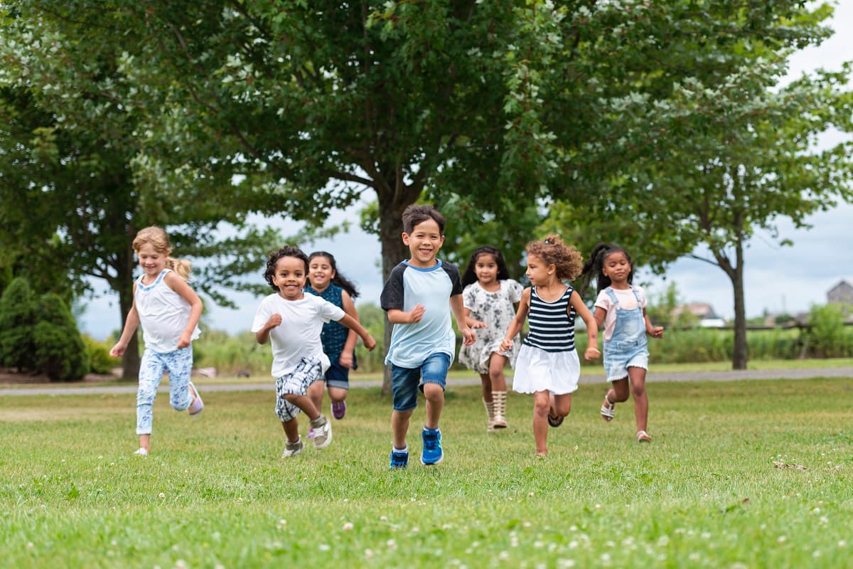 Children running and playing in a park