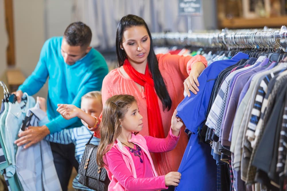 Family shopping for second-hand clothes