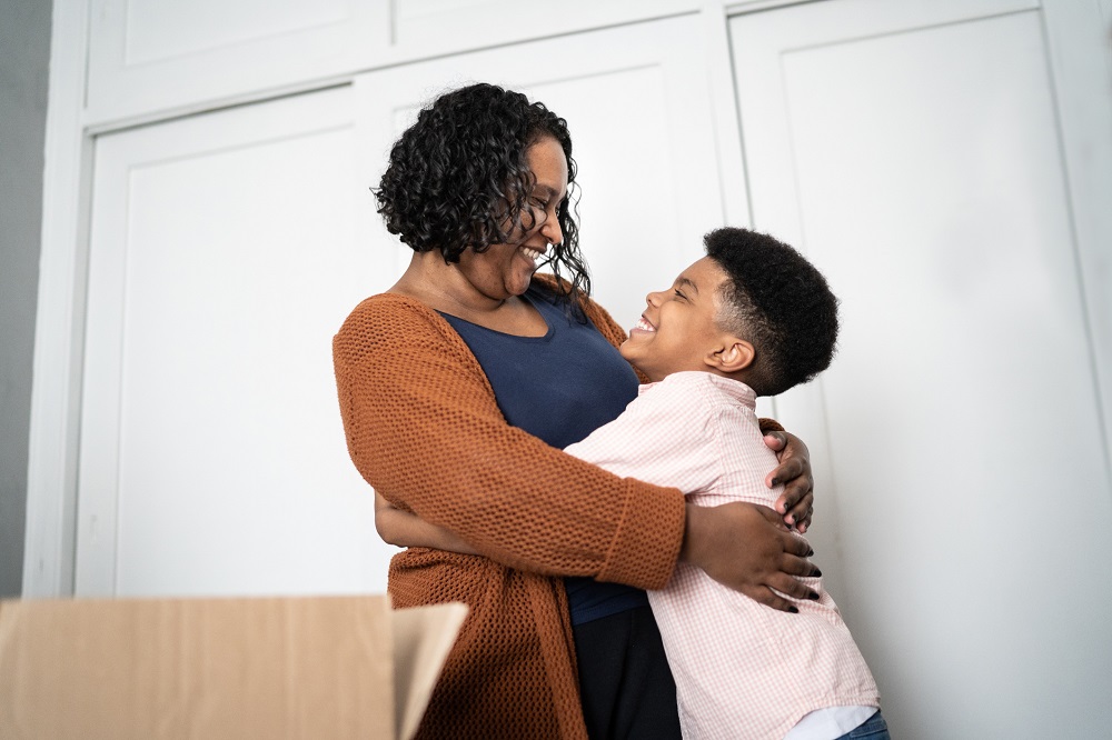 Mum and young son hugging