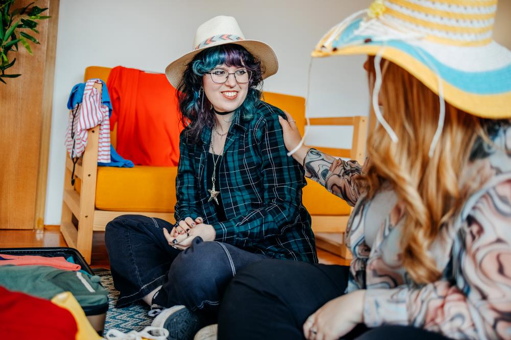 Teen girls trying on vintage clothes.