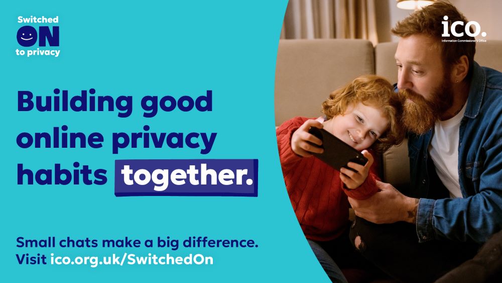 Dad and daughter looking at a phone goether with the caption Building good online privacy habits together'
