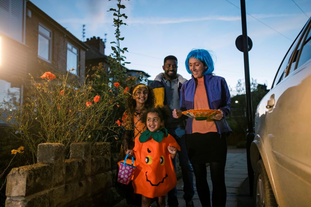Family out guising on Halloween.