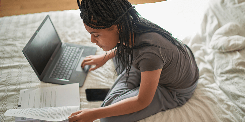 teen-girl-studying-on-bed-banner