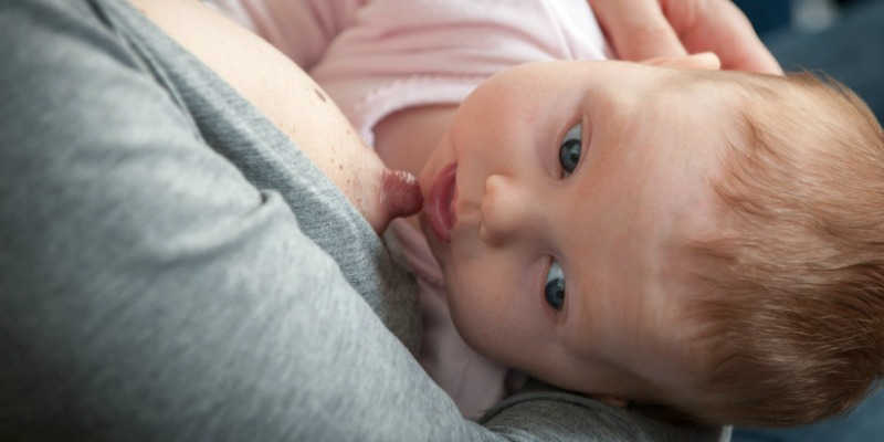 Photo of a baby breastfeeding