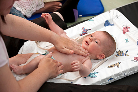 Photo of a baby having their nappy changed 
