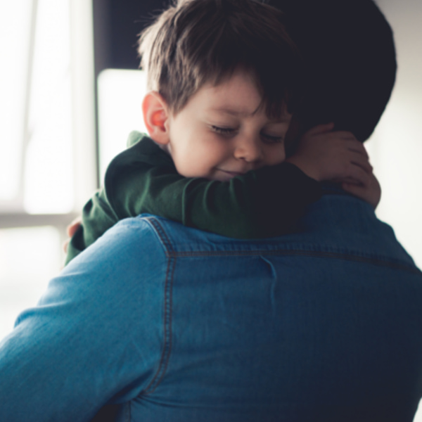 Photo of boy hugging his dad
