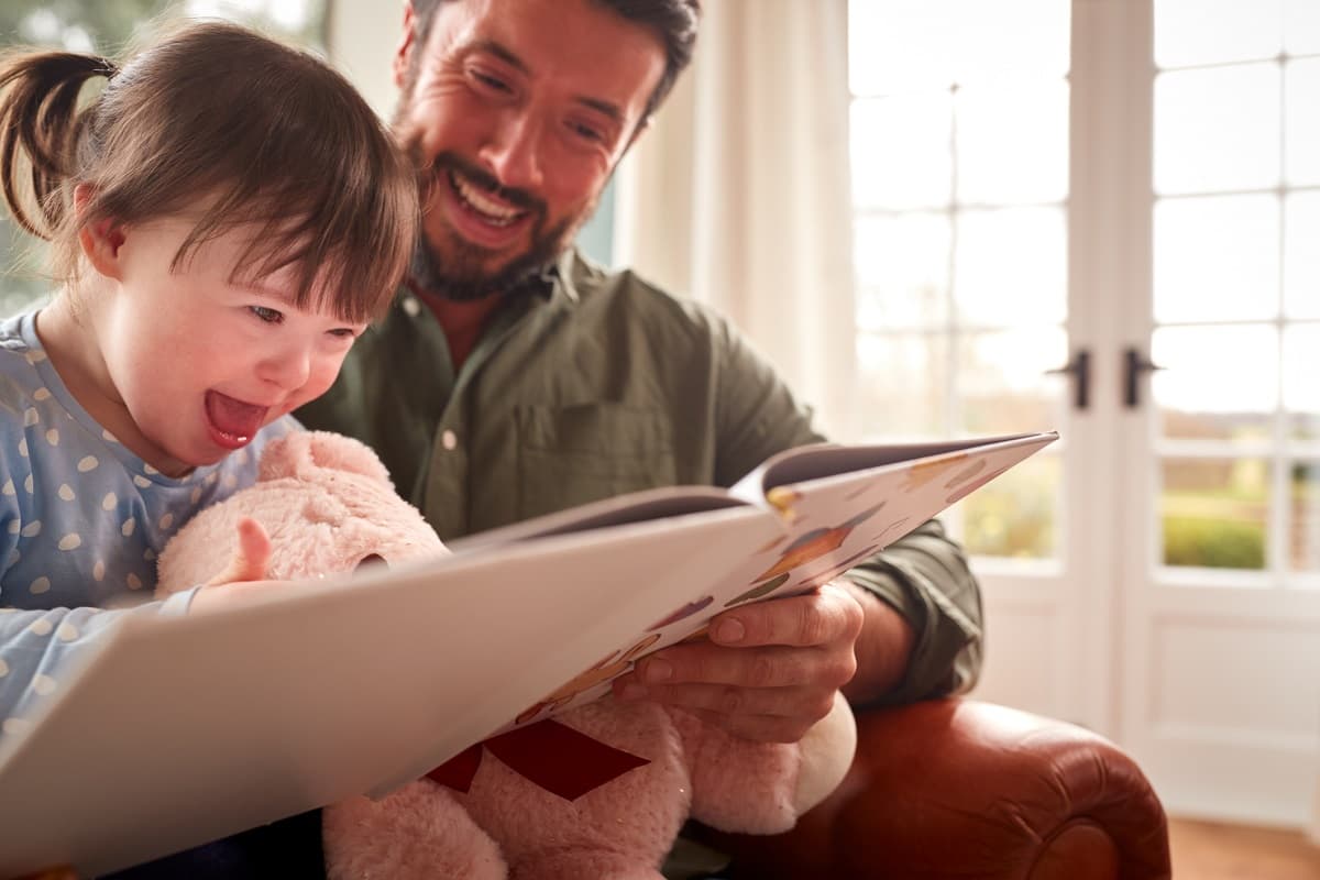 Child and father reading together