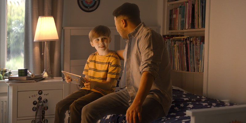 father-son-talking-with-tablet-banner