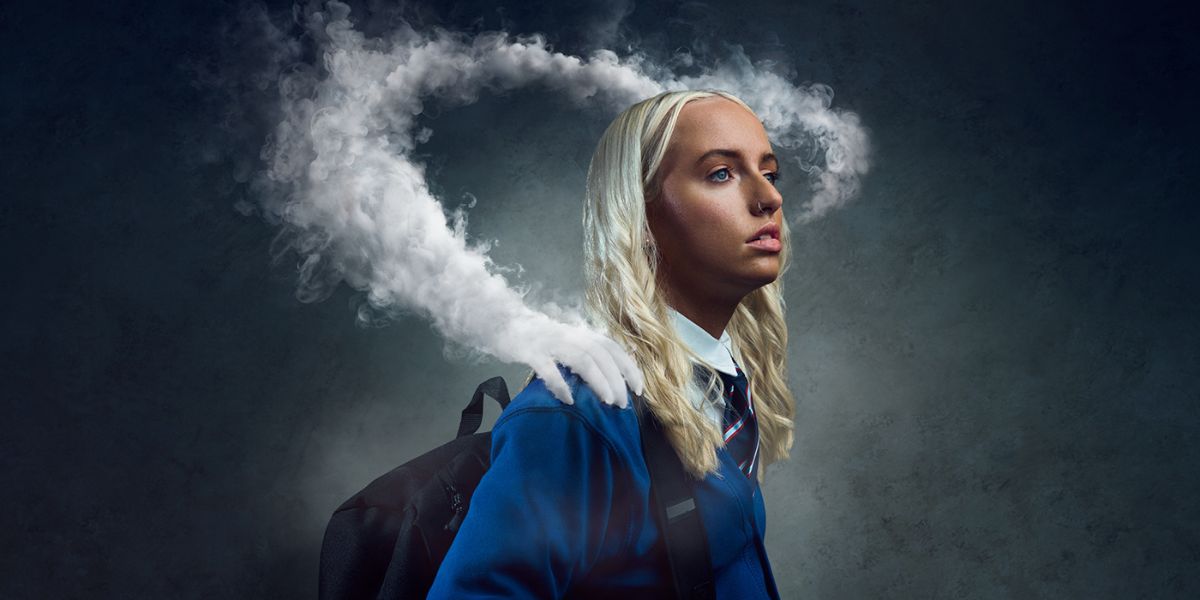 Girl vaping - the vape smoke has turned into a hand on her shoulder showing how addiction takes a hold