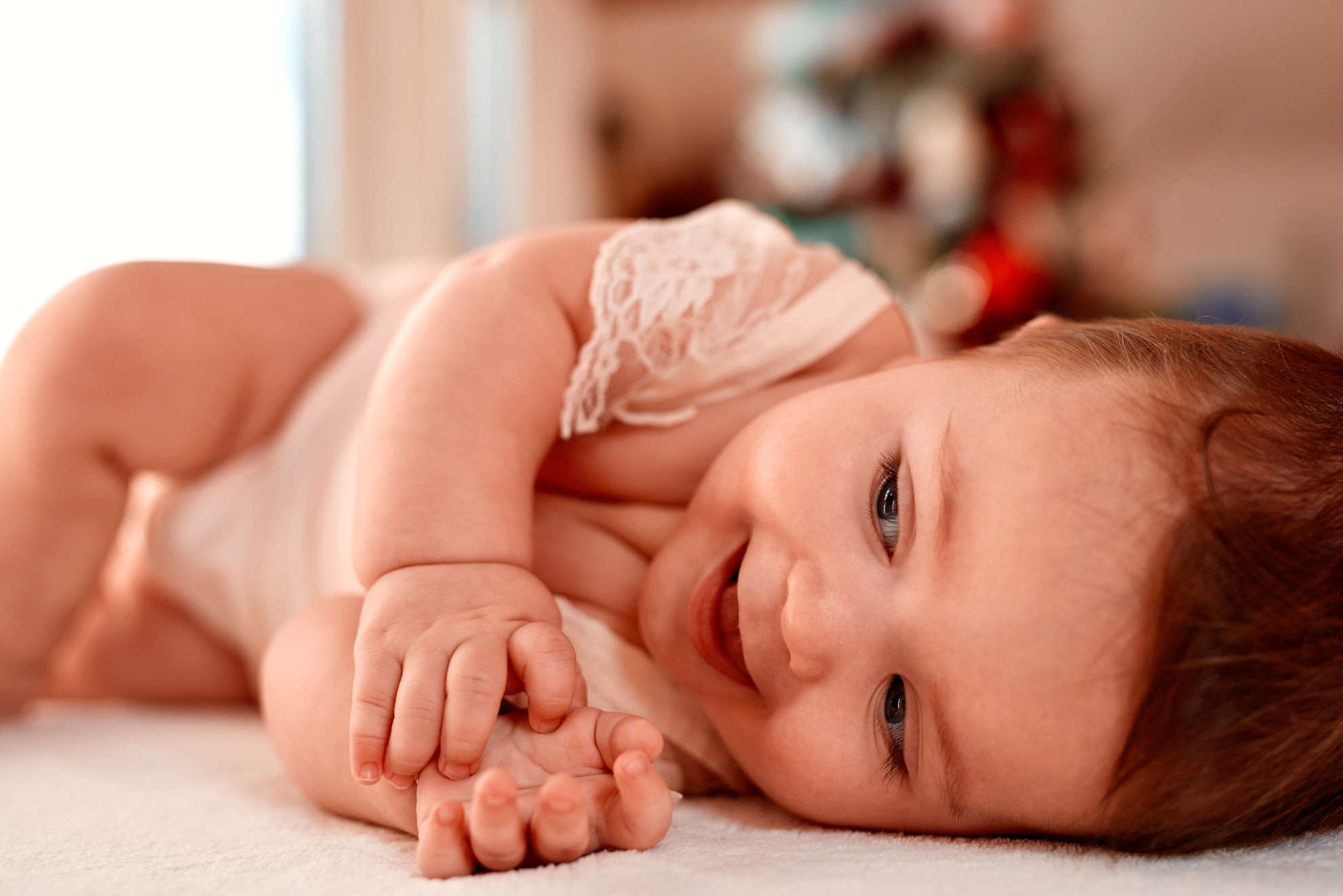 Photo of a baby lying on their side 
