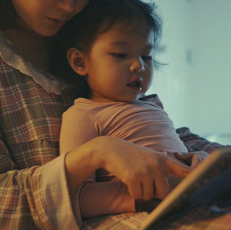 Mother reading to her toddler