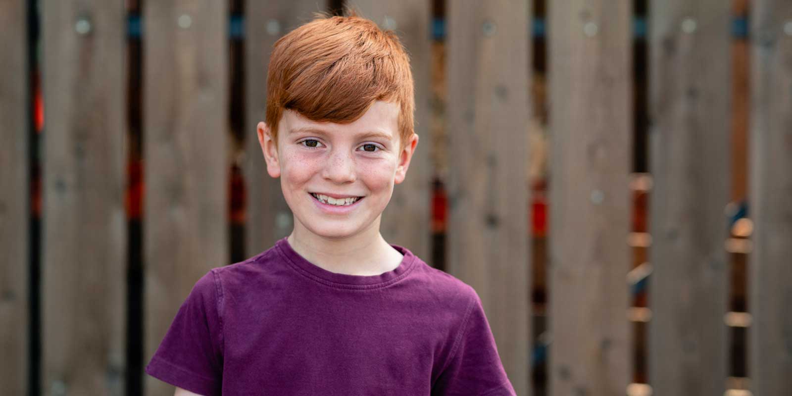 Smiling red haired boy