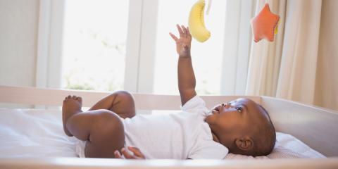 Photo of a baby reaching for their mobile 