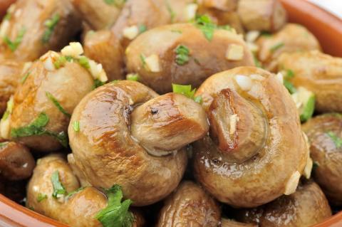 Photo of garlic covered mushrooms