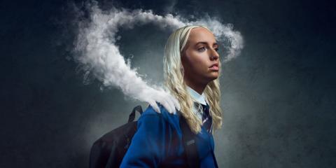 Girl vaping - the vape smoke has turned into a hand on her shoulder showing how addiction takes a hold