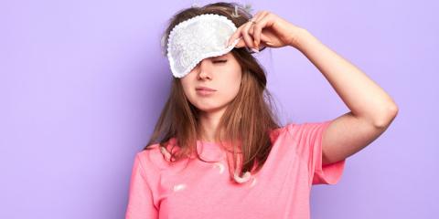 Sleepy teenager wearing eye mask