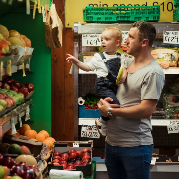 Photo of toddler shopping with dad