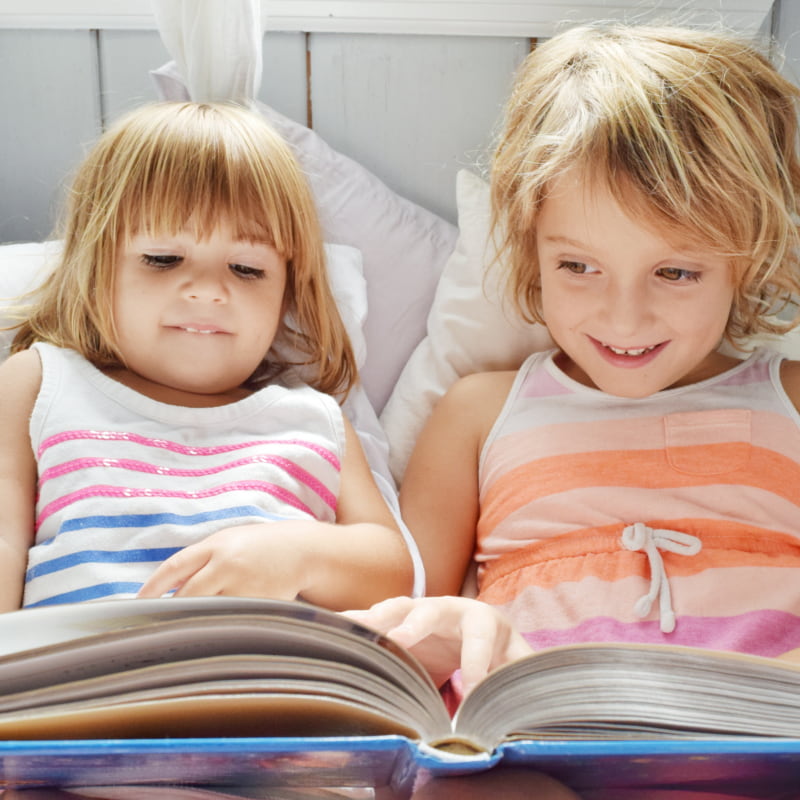Photo of sisters reading