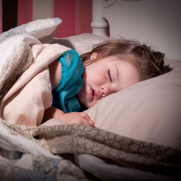 photo of toddler sleeping in bed
